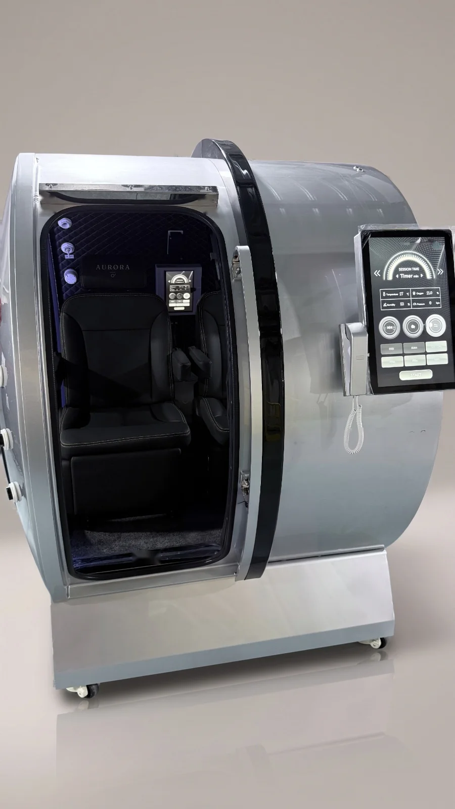 Aurora in a silver finish, the door open to the leather cabin and the touchscreen beside it